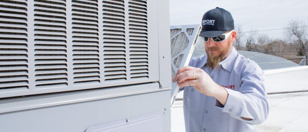 HVAC Tech working on AC