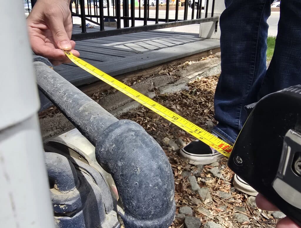 Technician Measuring A Pipe, Plumbing Math
